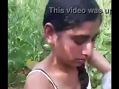 Desi girl eliminating clothes in field.